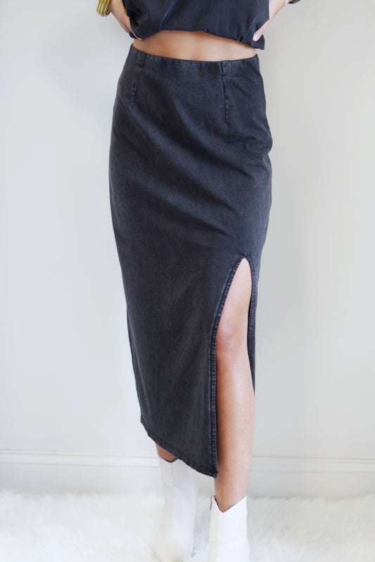 Shilo Knit Skirt Midi Length Color: Washed Black Knee Slit Loose Fit Care: Machine wash cold, delicate wash, gentle cycle, wash with like colors, do not bleach, do not tumble dry, hang to dry, warm iron if needed, ***wash before wearing*** Cotton Jersey: 100% Cotton Model is wearing Size S.