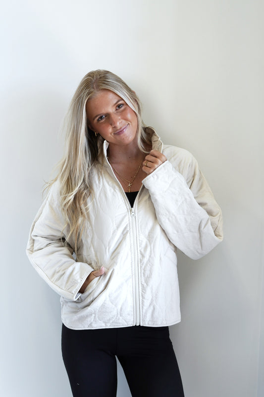 Quincy Quilted Woven Jacket Collar neckline Woven, Long Sleeve Elastic Cinch On Bottom Jacket Lining Side Pockets Zipper Closure Cream Color Fitted 100% Polyester
