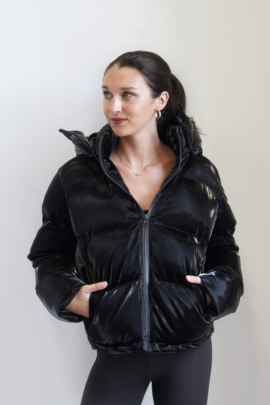 Hadley Hooded Shiny Puffer Jacket Collared Neckline Long Sleeves Detachable Hood Colors: Black, Puffer Style Zipper Oversized Look Skimmer Length Pockets 55% PU, 40% Polyester, 5% Spandex