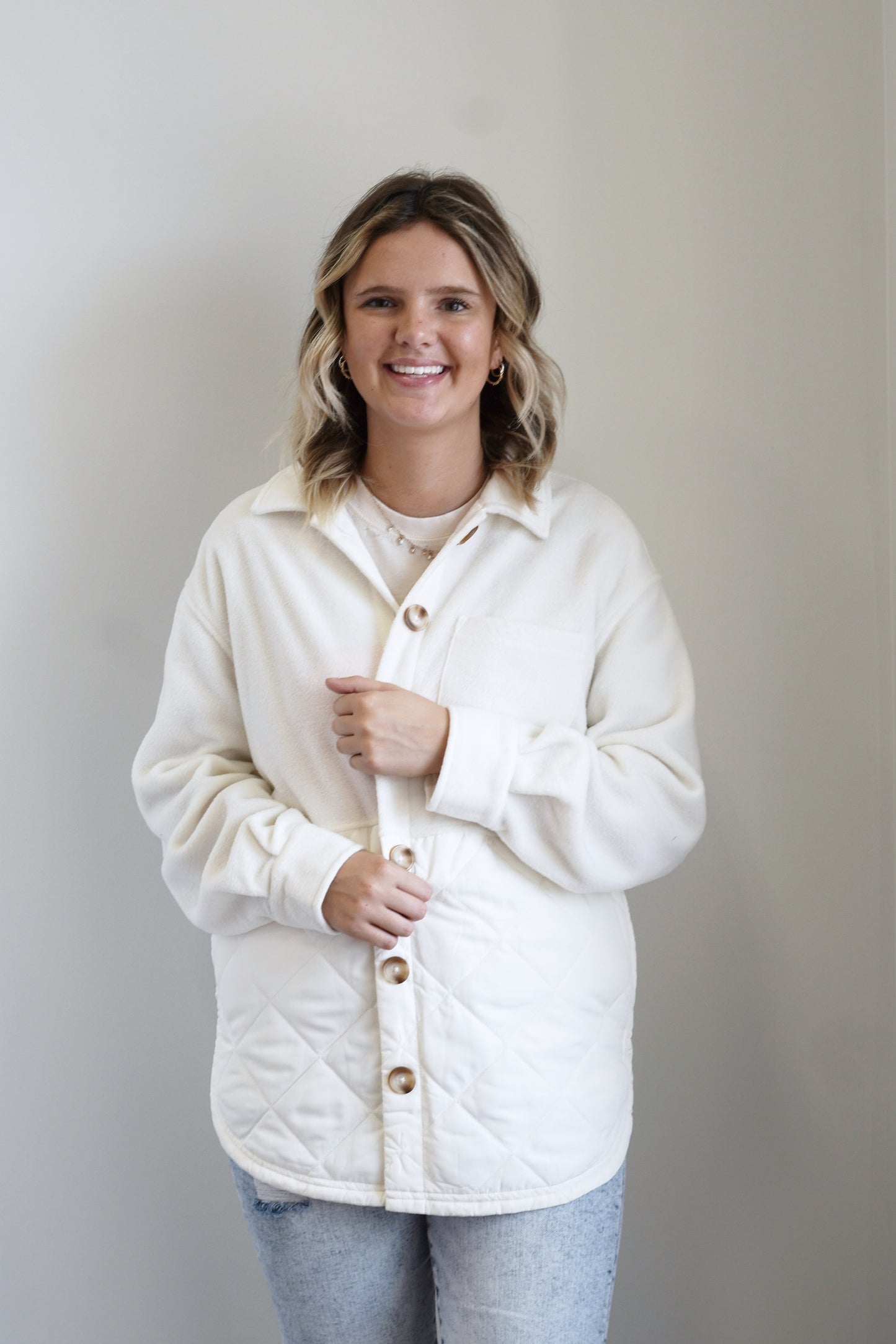 Jump Start Jacket Collared Neckline Long Cuffed Sleeves Quilted Fabric Detail Colors: Sandstone, Brown Buttons Front Pockets Side Slits 100% Polye