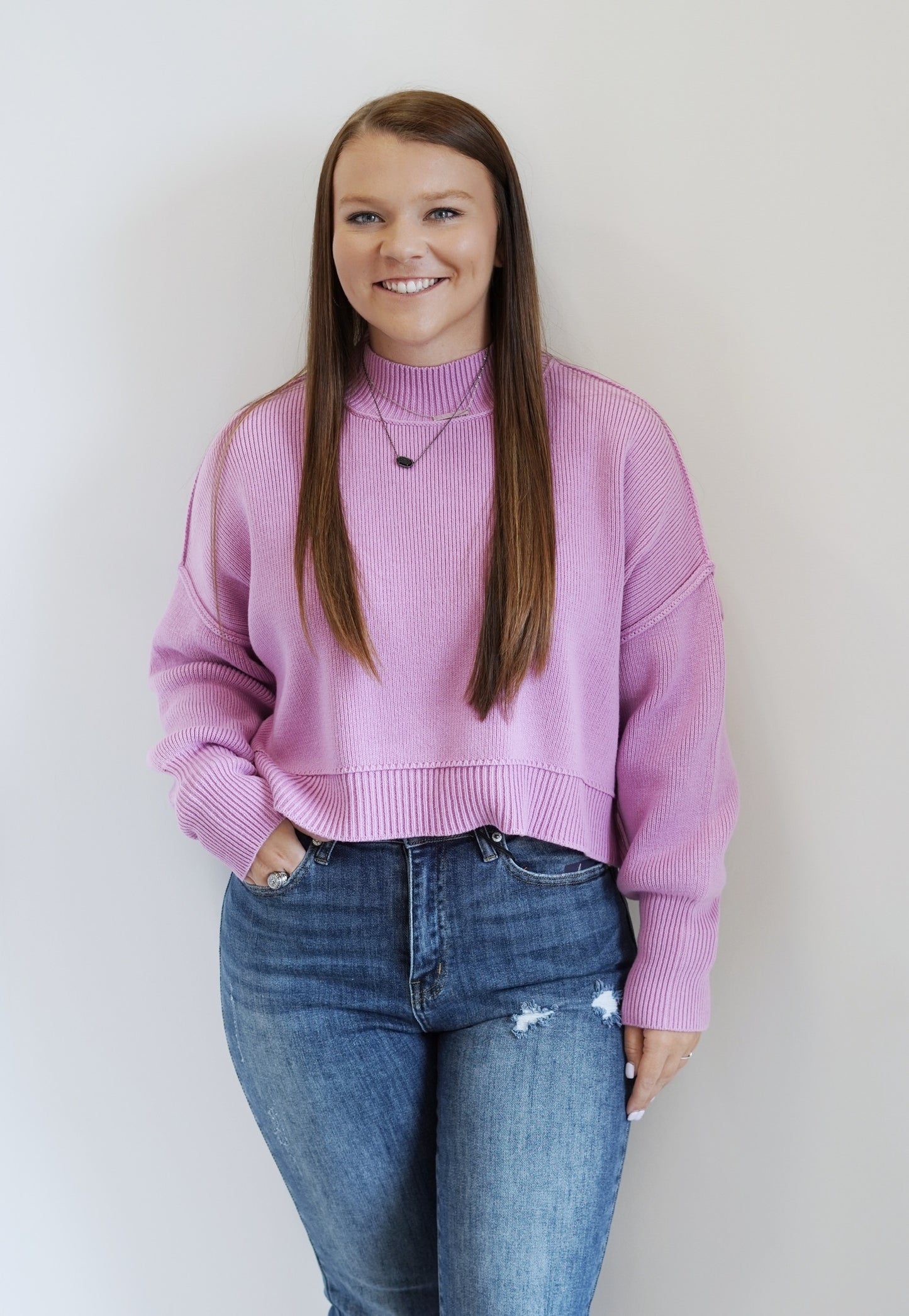 Nomi Knit Oversized Cropped Sweater Mock Neckline Long Cuffed Sleeves Double Knit Hems Small Side Slits Lavender Color Cropped Length Oversized Fit 56% Cotton, 38% Acrylic, 6% Nylon