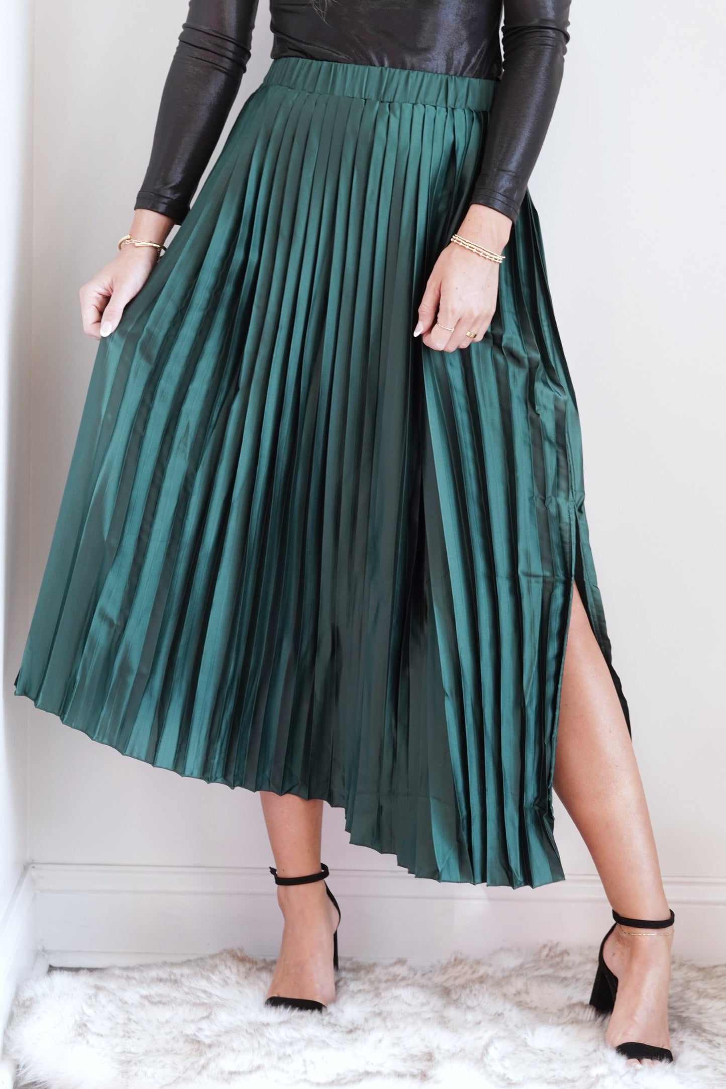 Polly Pleated Asymmetrical Hem Satin Midi Skirt Elastic Waistband Asymmetrical Hem Side/Front Slit Midi Length Flowy Pleated Material Colors: Hunter Green,97% Polyester, 3% Elastane