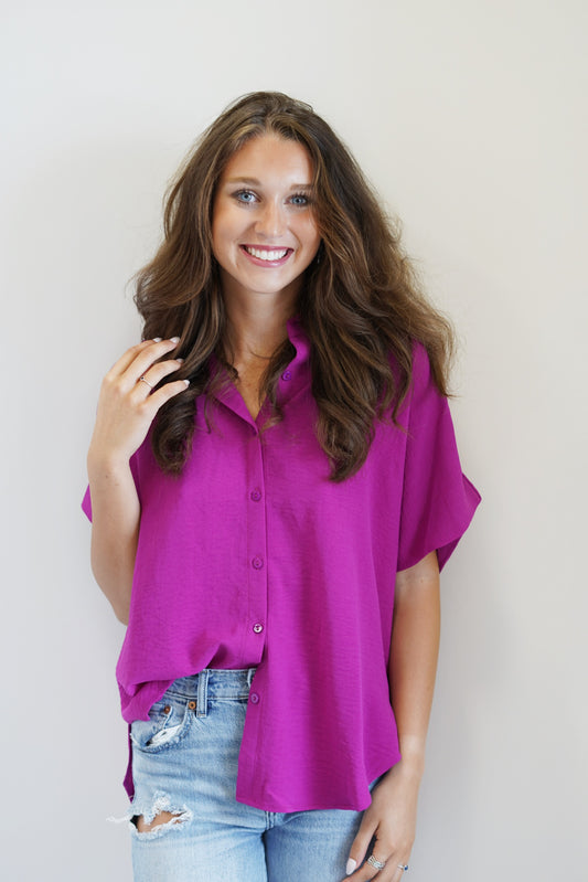 Olivia Button Up Blouse Collared Button Up Blouse Short Sleeved Color: Magenta 95% Polyester 5% Spandex Hand Wash Cold, Do Not Wring Or Twist, Use Only None Chlorine Bleach, Line Dry, Low Iron If Needed Model is wearing size: Small