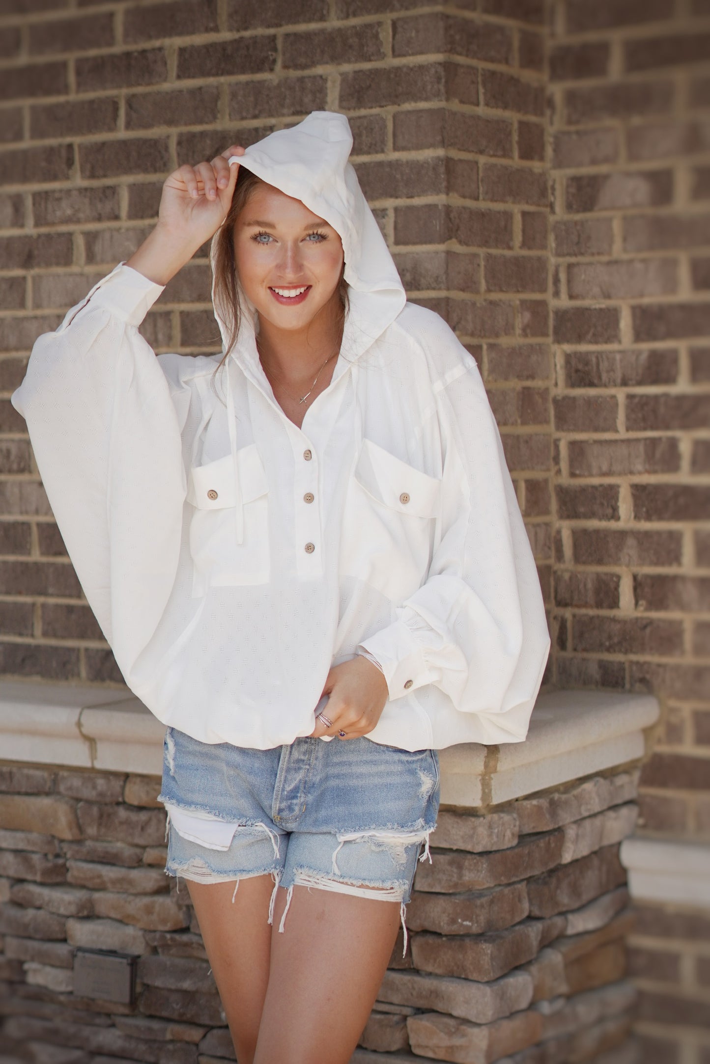 Hensley Lightweight Textured Hoodie Collared Button Up Neckline Batwing Sleeve Textured Look Front Pockets Hood Cinch-able Wasitline 100% Polyester Care: Hand Wash Cold, Do Not Bleach, Line Dry Model is wearing a size small