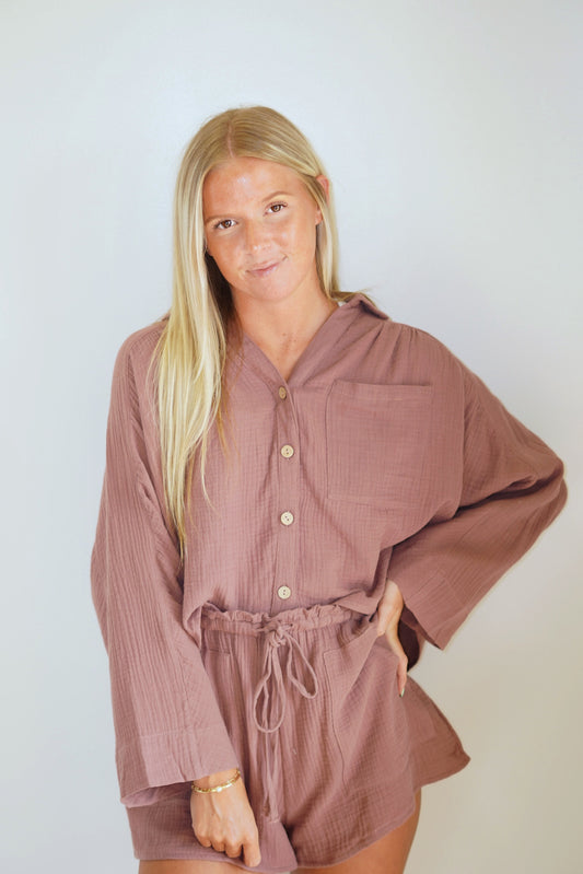 Tulla Textured Cotton Button Up Top Collared Neckline Button Up Red Bean Color Skimmer Length Gauze Material 100% Cotton Model is wearing size small CARE: Hand Wash Cold, Hang to Dry, No Bleach