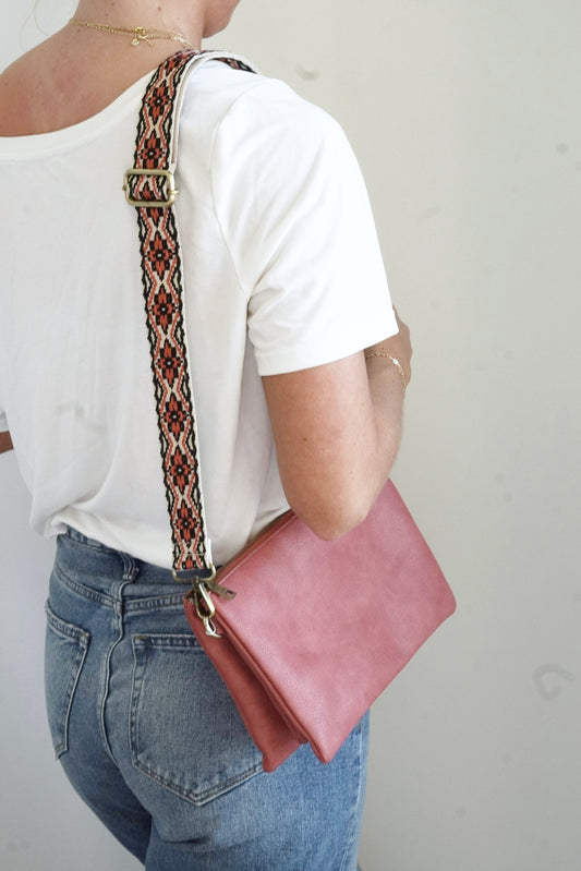 Izzy Oversized Crossbody Wallet Expandable Two Large Inner Pockets Middle Zipper Pocket Six Credit Card Slots Removeable Adjustable Guitar Strap and Wrist Strap Approx 10 in. x 6 1/2 in. x 1 1/2 in. Bottom expands to approx. 5 in. terracotta color