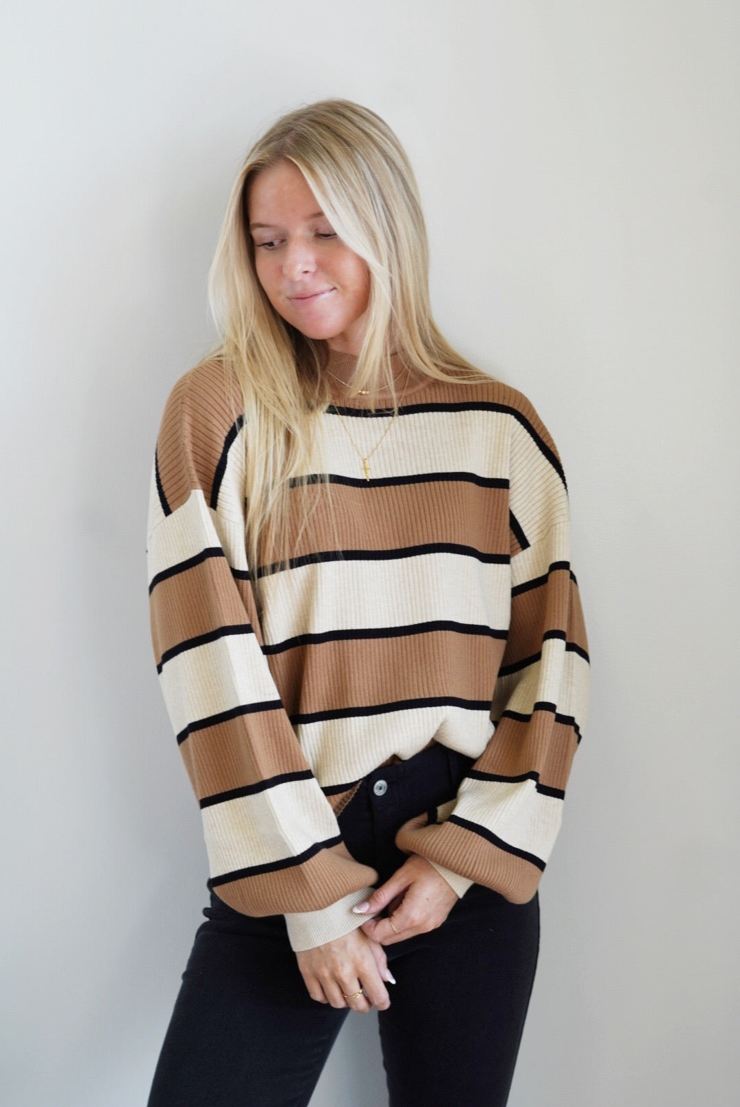 Savannah Striped Sweater Round Neckline Long Cuffed Sleeves Striped Pattern Large Cream and Brown Stripes with Smaller Black Stripes Full Length Relaxed Fit 50% Rayon, 28% Polyester, 22% Nylon