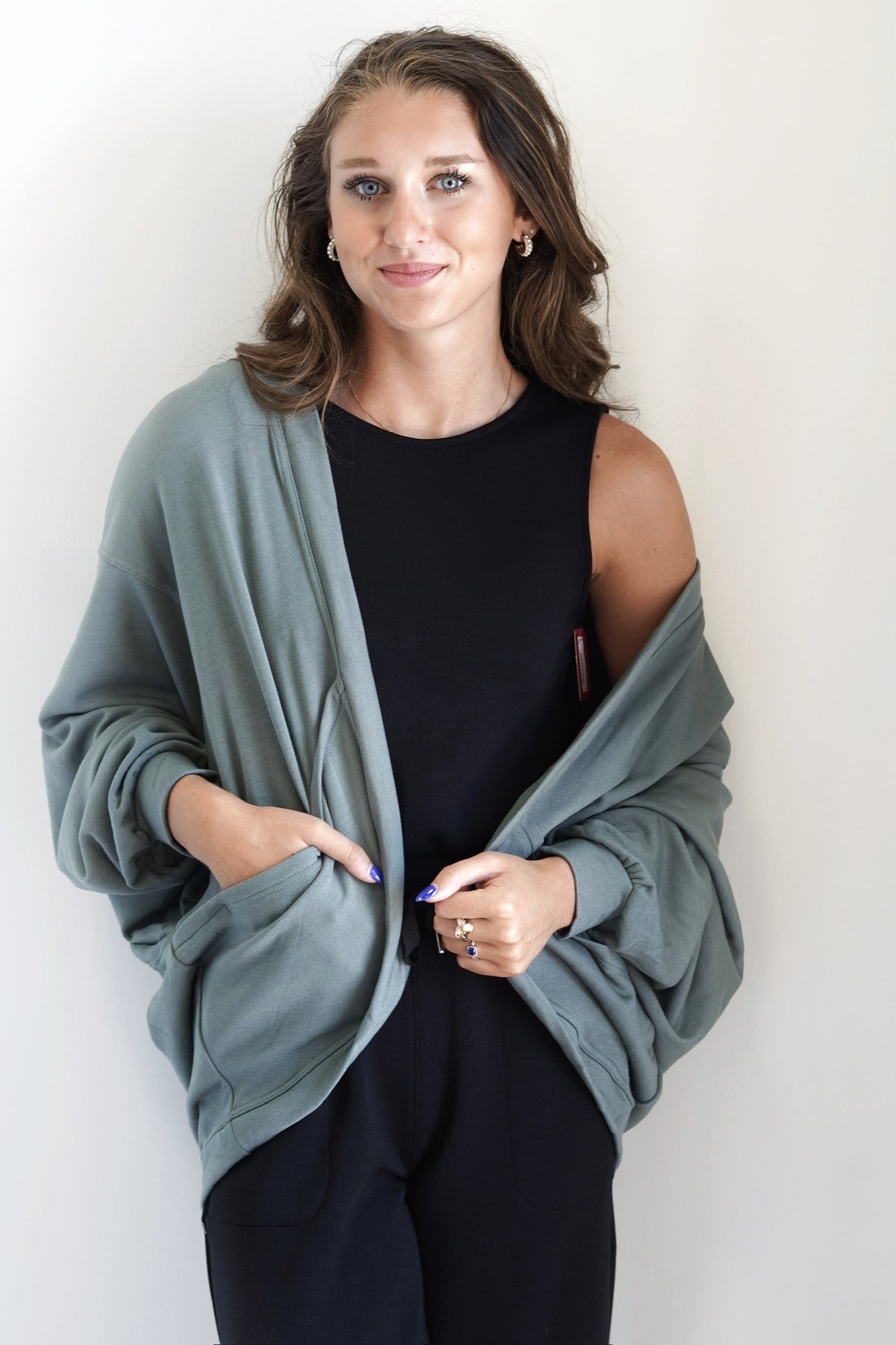 Colleen Cozy Cocoon Pocket Cardigan Open Front Front Pockets Long Cuffed Sleeves Relaxed Fit Stretchy Material Green Color 62% Rayon, 35% Polyester, 3% Spandex
