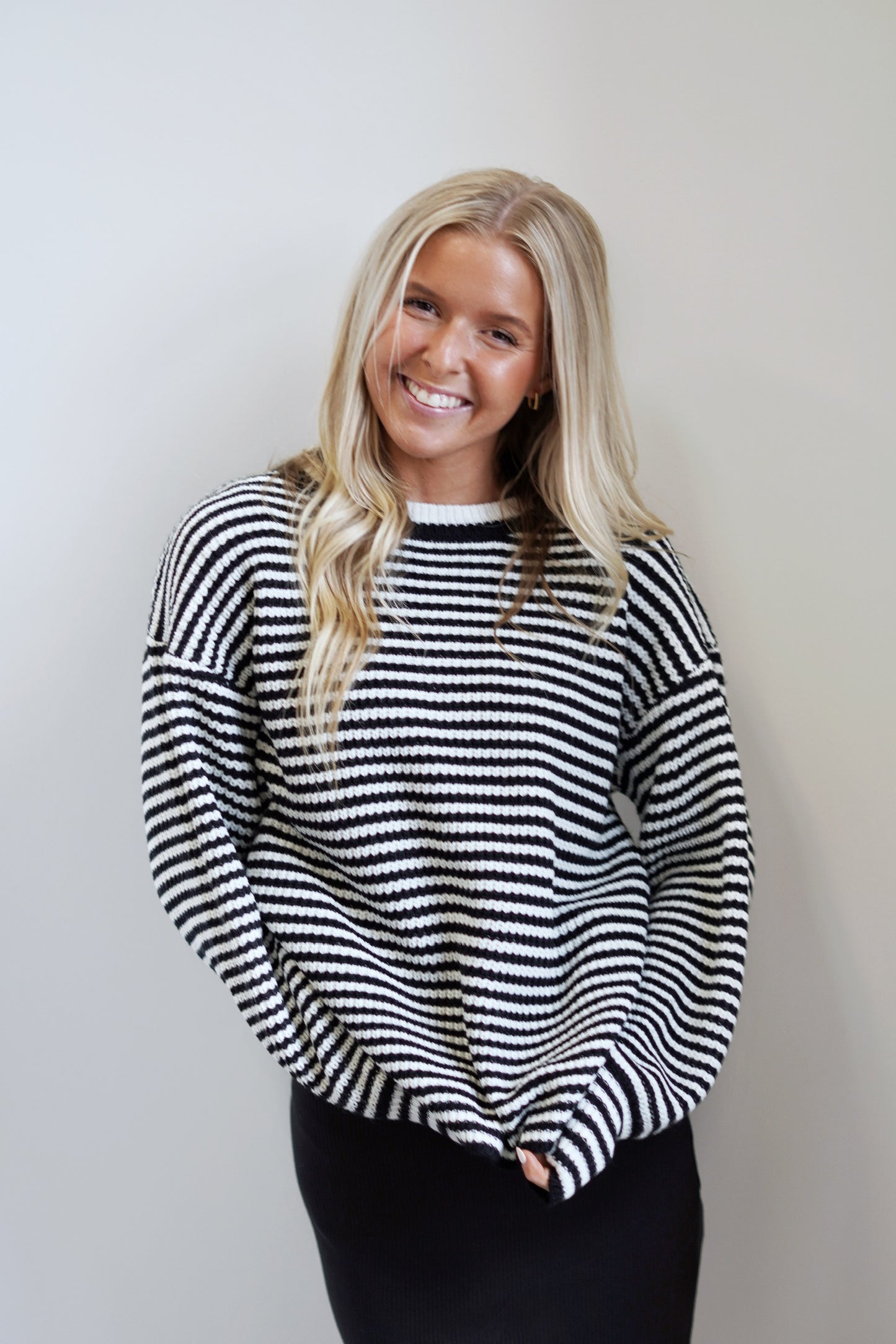 Betty Black and White Striped Sweater Round Neckline Double Knit Fabric Long Cuffed Sleeves Full Length Black and White Striped Color Relaxed Fit 100% Acrylic