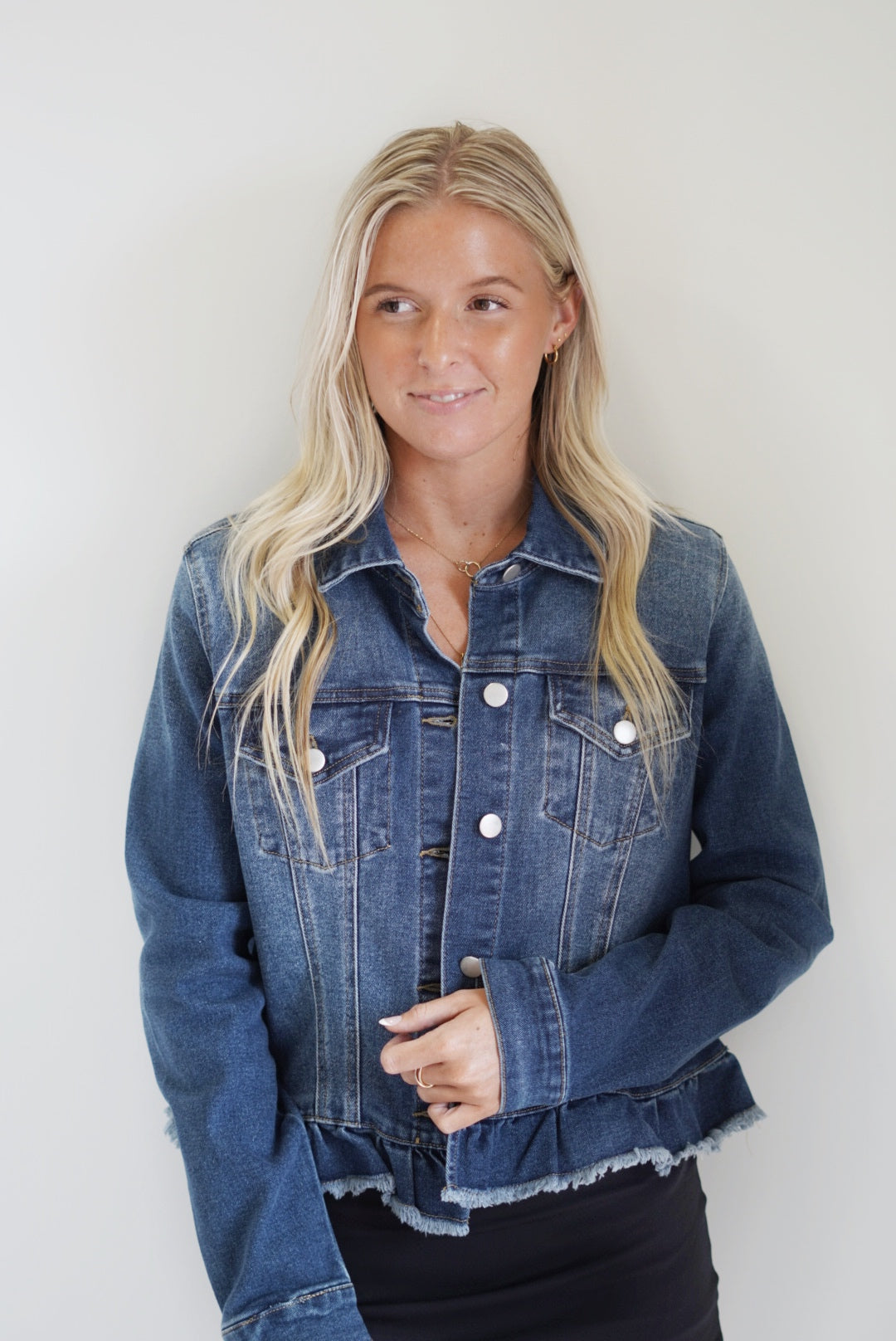 Raleigh Ruffled Raw Hem Denim Jacket Collared Neckline Long Sleeve Ruffled Hem Colors: Light Denim, Dark Denim Skimmer Length 70% Cotton, 26% Polyester, 3% Rayon, 1% Spandex Care:Machine Wash Cold, Tumble Dry Slow Model is wearing a size small