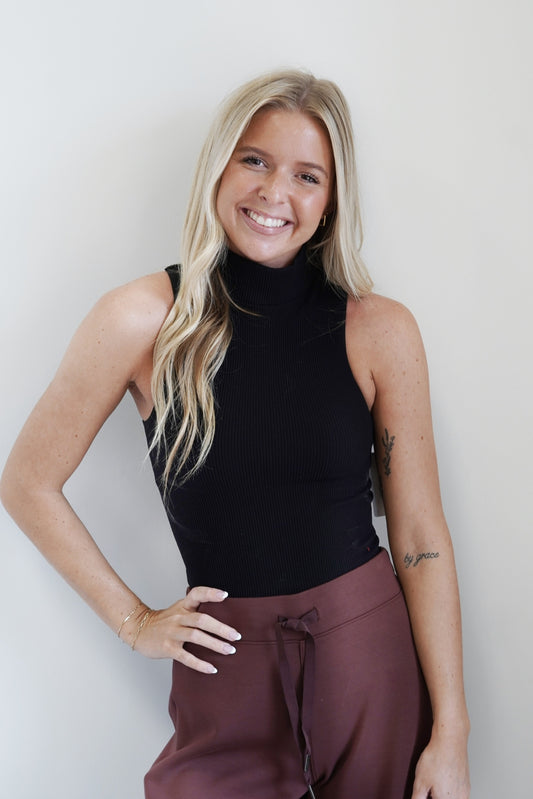 Mer Mock Neck Sleeveless Top Mock Neckline Sleeveless Ribbed Material Colors: , Black Fitted Cropped 92% Nylon, 8% Spandex