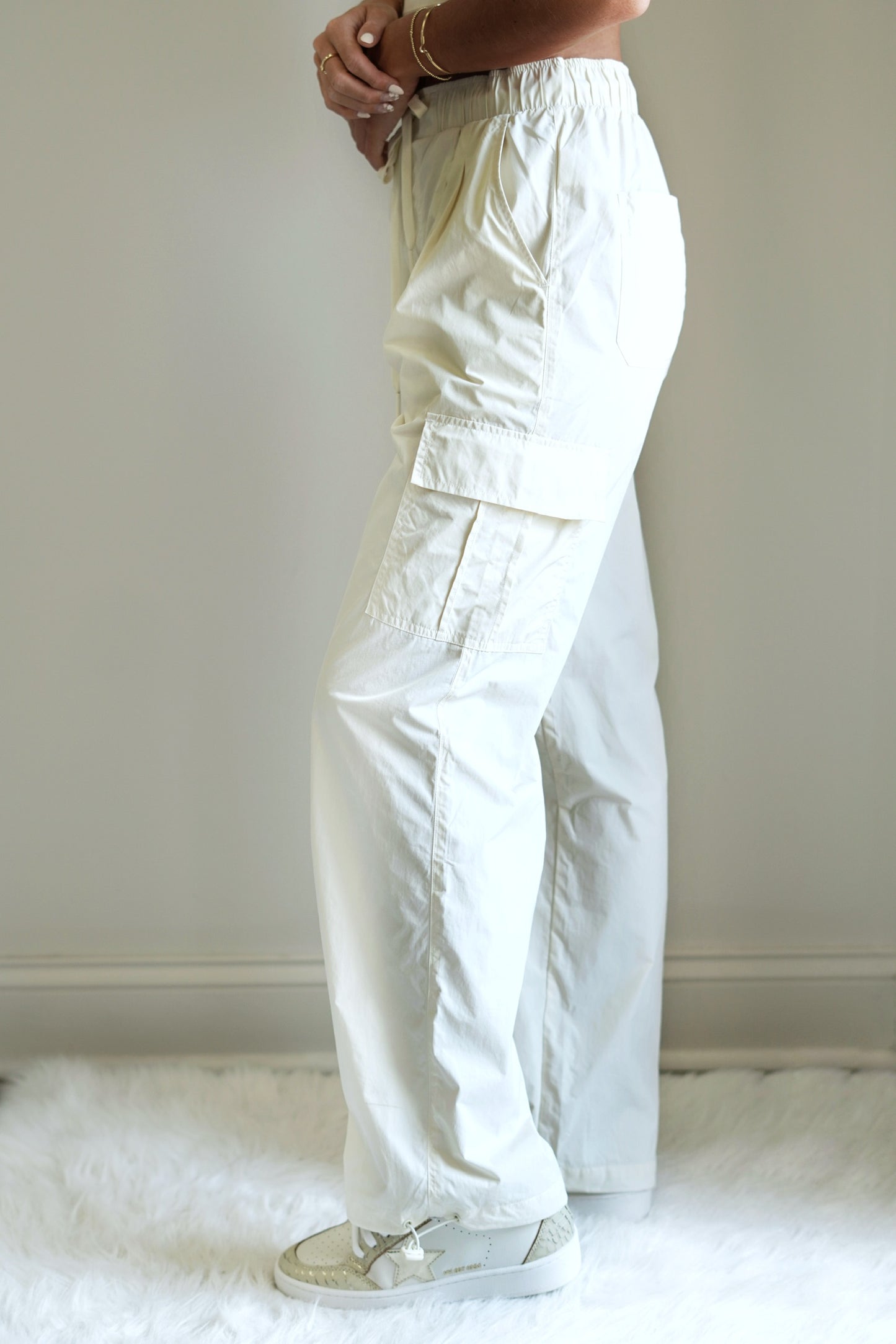 Out and About Cargo Pants Drawstring Elastic Waistband Straight Leg Cinch-able Cuffs Around the Ankles Multiple Pockets Sandstone Color Full Length Relaxed Fit 100% Nylon