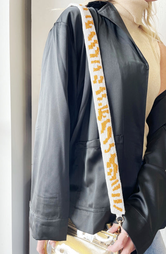 Striped Beaded Purse Strap Gold Clasps on Each End Guitar Strap Style Approx. 48 1/2 inches including clasps Colors: White w/ Orange Stripes