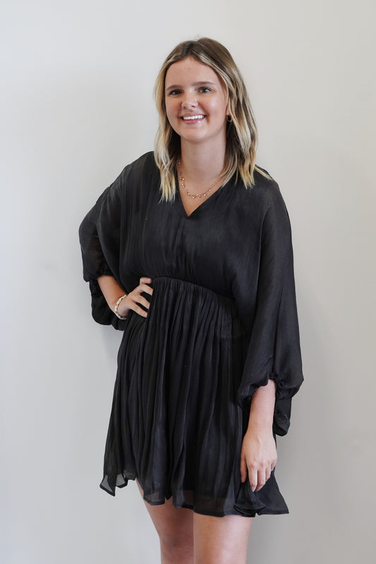 Shimmer Chiffon Balloon Sleeve Dress V-Neckline 3/4 Length Balloon Sleeves Shiny Chiffon Fabric Above the Knee Length Relaxed and Flow Fit Shiny Black Color 100% Polyester