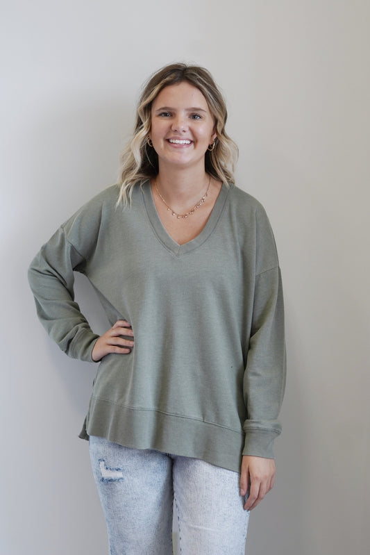 Modern V-Neck Weekender V-Neckline Side Slits Detail Long Cuffed Sleeves Color: Evergreen Relaxed Fit Full Length 60% Cotton, 40% Polyester