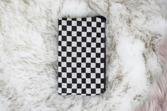 Riley Patterned Crossbody Wallet 5 Compartments 6 Card Slots 1 Interior Zipper Zipper Closer Colors: Black/White Checkered, One Crossbody Strap, One Wristlet Strap - Both Removable 8.5 x 5.5in