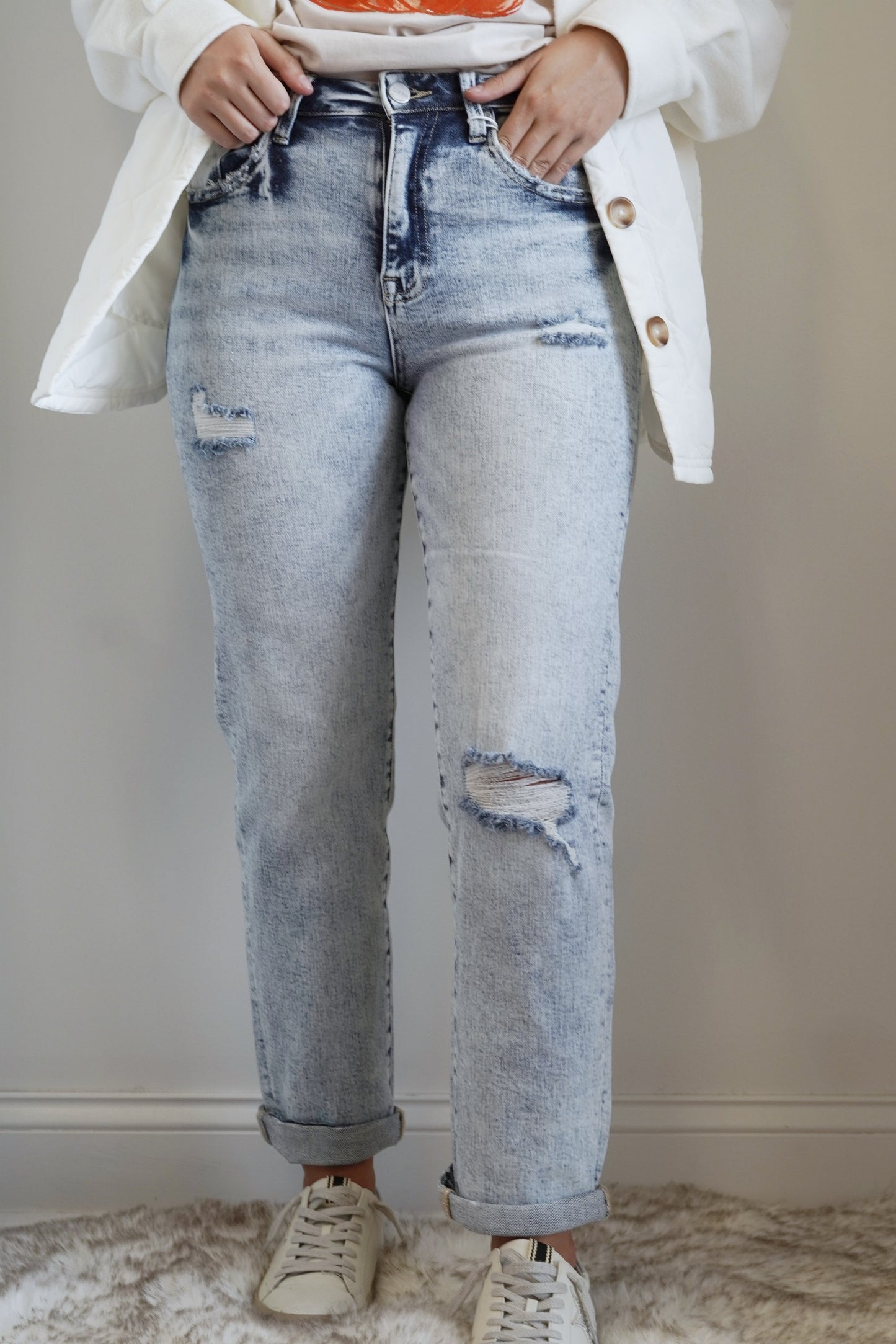 Dani Distressed Boyfriend Jeans Belt Loops on Waistline Button/Zipper Closure Straight Leg Jeans Pockets on Front and Back of Jeans Light Wash Distressed Adjustable Roll Up Hem 95% Cotton, 3.5% Polyester, 1.5% Spandex