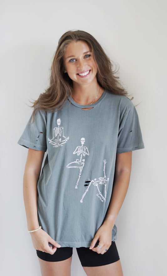 Dylan Distressed Yoga Skeleton Graphic Tee Crew Neckline Short Sleeves Distressed Detailing Grey Color Full Length Loose Fit 100% Cotton Machine Wash Cold Model is Wearing a Size Medium