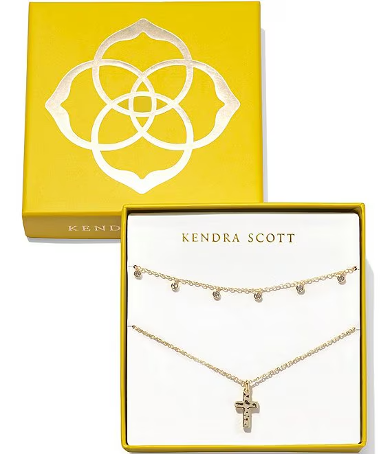 Gift set of 2 necklaces. Comes with box. Both necklaces are gold. One necklace is the amelia chain necklace with small crystals throughout the necklace. other necklace has the cross pendant. 