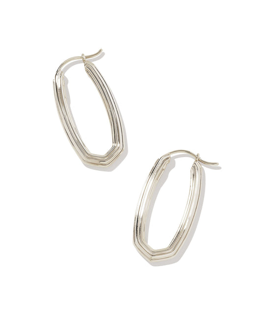 Looking for a modern addition to your hoop collection? Meet the Heather Hoop Earrings. With their elongated oval shape and subtle ridged texture, these hoops have the perfect amount of contemporary flair.  Silver