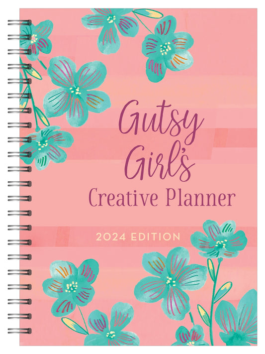 Pink spiral bound bookcover with green flowers. "Gutsy Girl's Creative Planner 2024 Edition"
