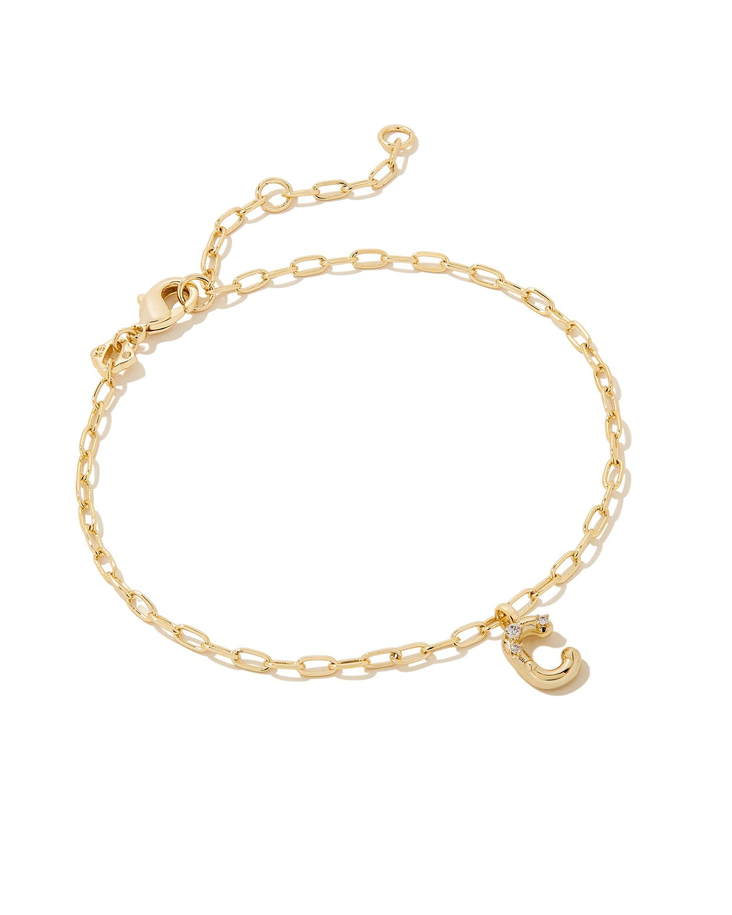 Add a personal touch to your wrist stack with the Crystal Delicate Chain Bracelet in White Crystal, our first Fashion Jewelry initial bracelet. Featuring a dainty chain and letter charm with a hint of sparkle, this bracelet is the perfect way to celebrate the ones you love—including yourself!  Dimensions- 6.5' CHAIN WITH 1.5' EXTENDER, 0.45'L X 0.26"W PENDANT Metal- 14K Gold plated over brass Closure- Lobster Clasp Material-  White CZ Letter C