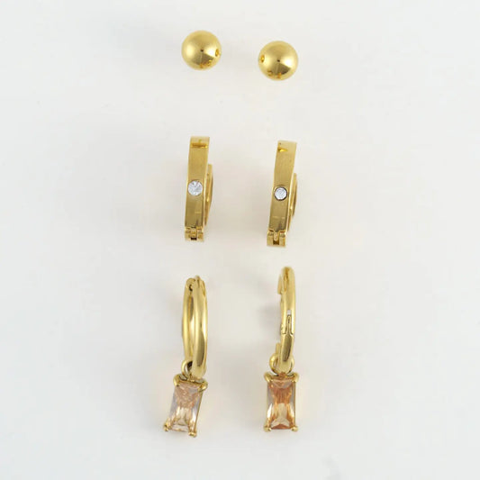 Gold earring trio, ball stud, gold hoop, and hoop with pink crystal pendant