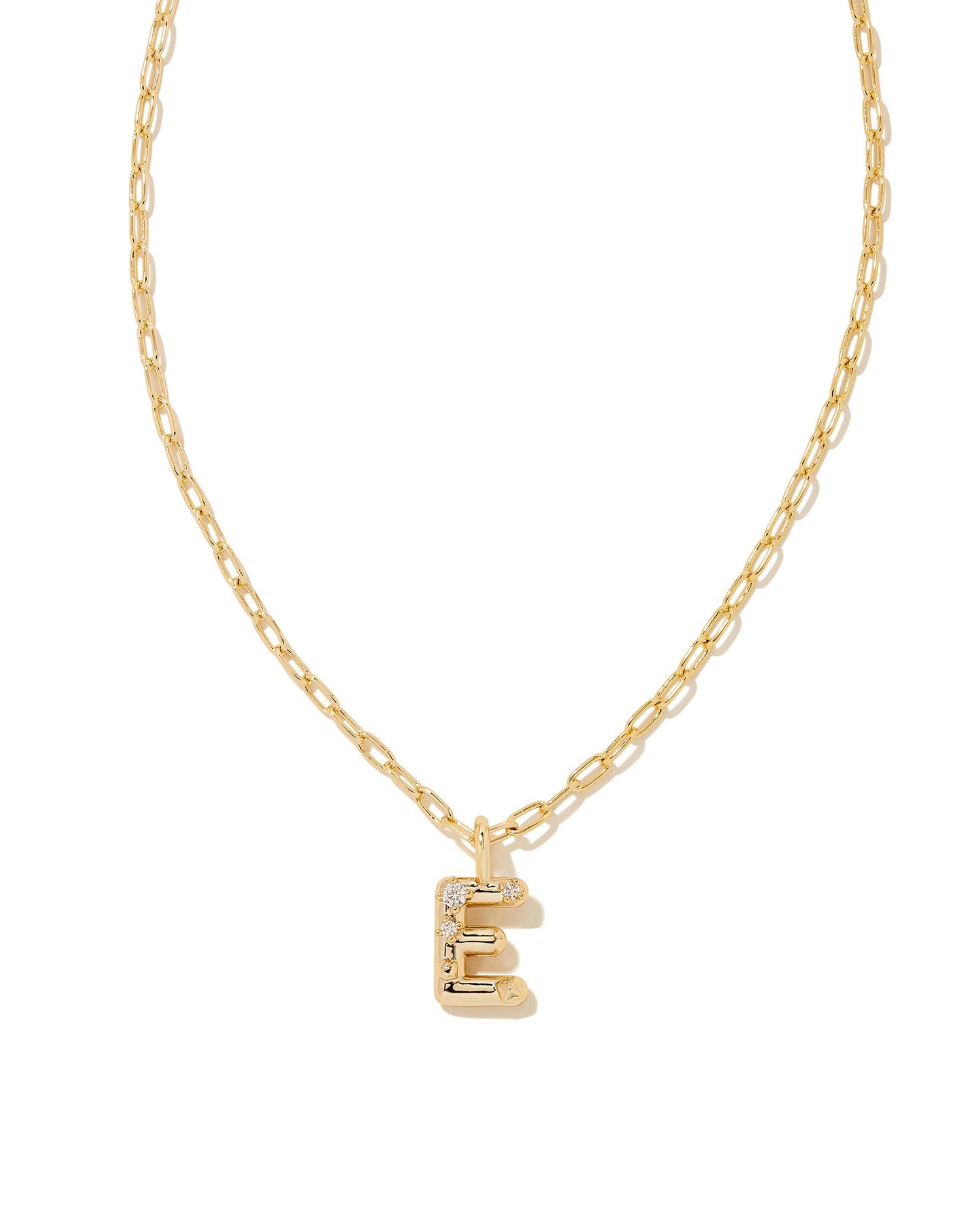 Personalize your everyday look with the Crystal Letter Short Pendant Necklace in White Crystal. Whether you’re rocking your initial or a loved one’s, this sentimental layer is one you’ll keep coming back to again and again.  Dimensions- 16' CHAIN WITH 3' EXTENDER, 0.62'L X 0.35"W PENDANT Metal- 14K Gold plated over brass Closure- Lobster Clasp Material-   White CZ Letter E