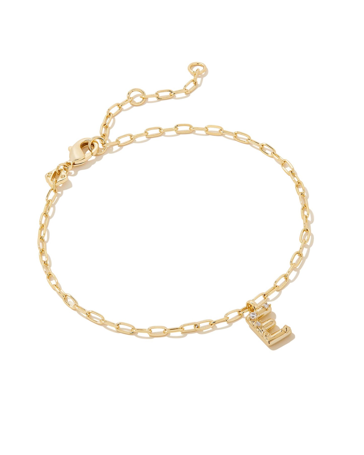 Add a personal touch to your wrist stack with the Crystal Delicate Chain Bracelet in White Crystal, our first Fashion Jewelry initial bracelet. Featuring a dainty chain and letter charm with a hint of sparkle, this bracelet is the perfect way to celebrate the ones you love—including yourself!  Dimensions- 6.5' CHAIN WITH 1.5' EXTENDER, 0.45'L X 0.26"W PENDANT Metal- 14K Gold plated over brass Closure- Lobster Clasp Material-  White CZ letter E