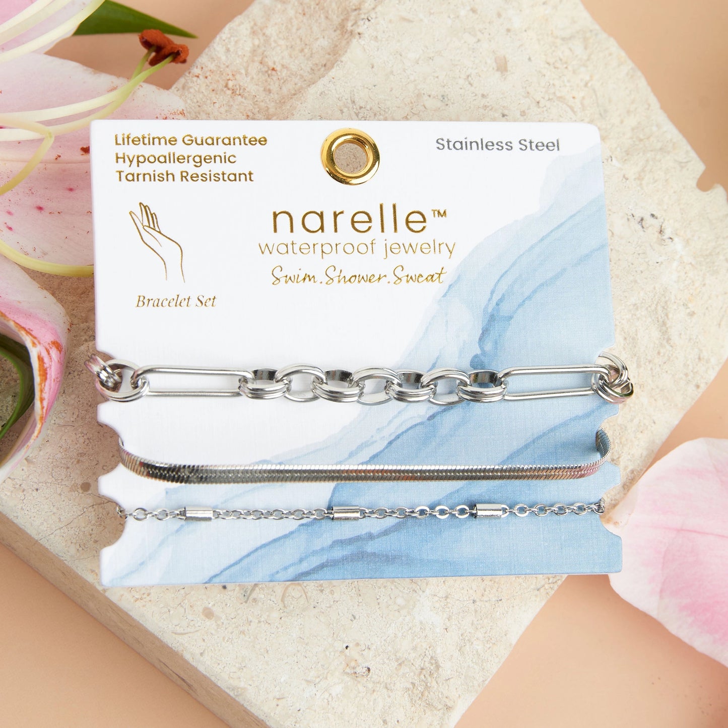 three silver bracelets in  Paper Clip, Snake, and Dainty Chain designs.