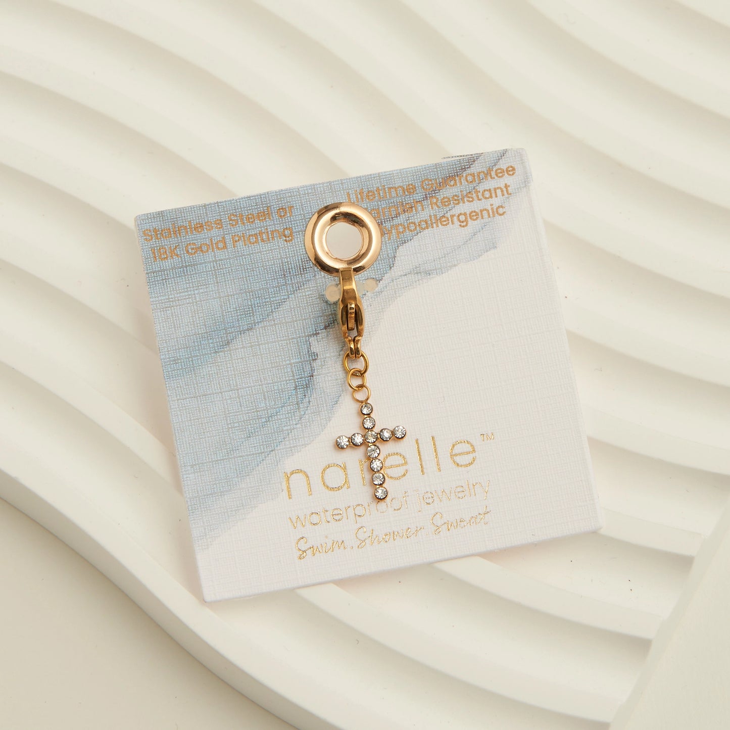 Gold cross charm cubic zirconia detail, with a lobster clap. 