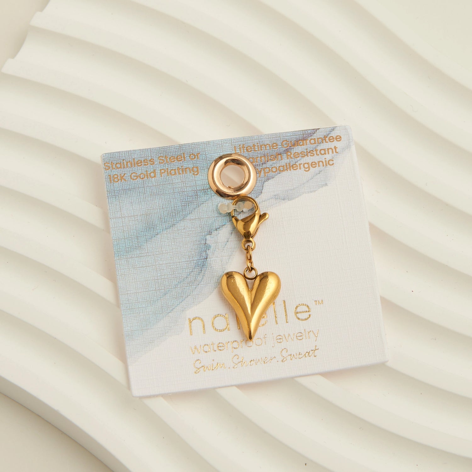 Gold heart charm with a lobster clap. 