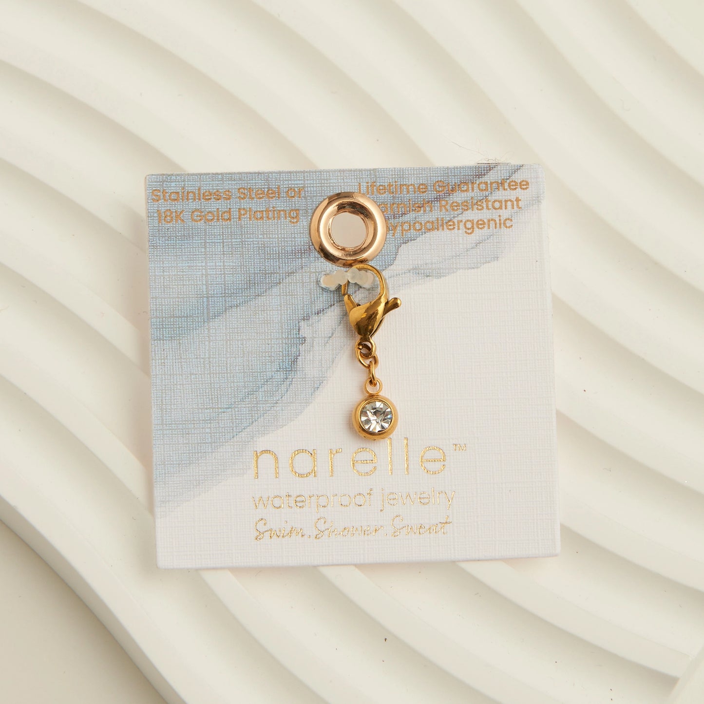 cubic zirconia circle charm with a gold lobster claps 