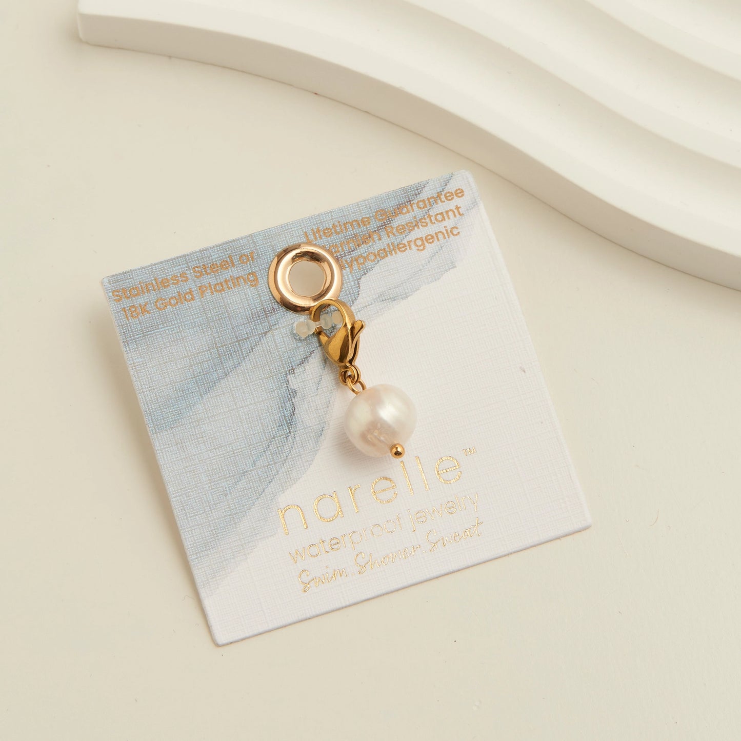 pearl charm with a lobster gold claps 