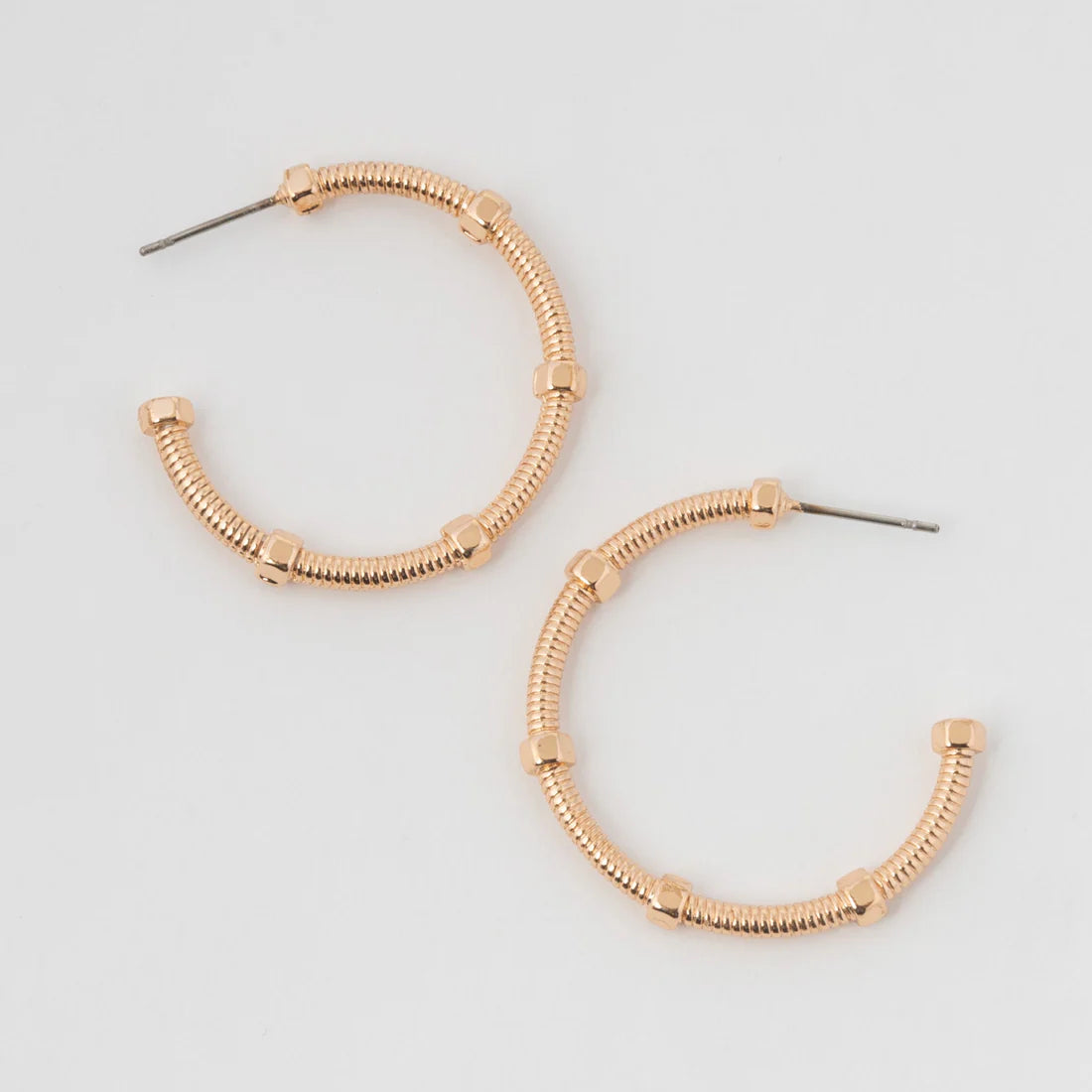  Gold classic hoop, the Medium Textured C Hoop Earrings feature a stylish fun textured design. 