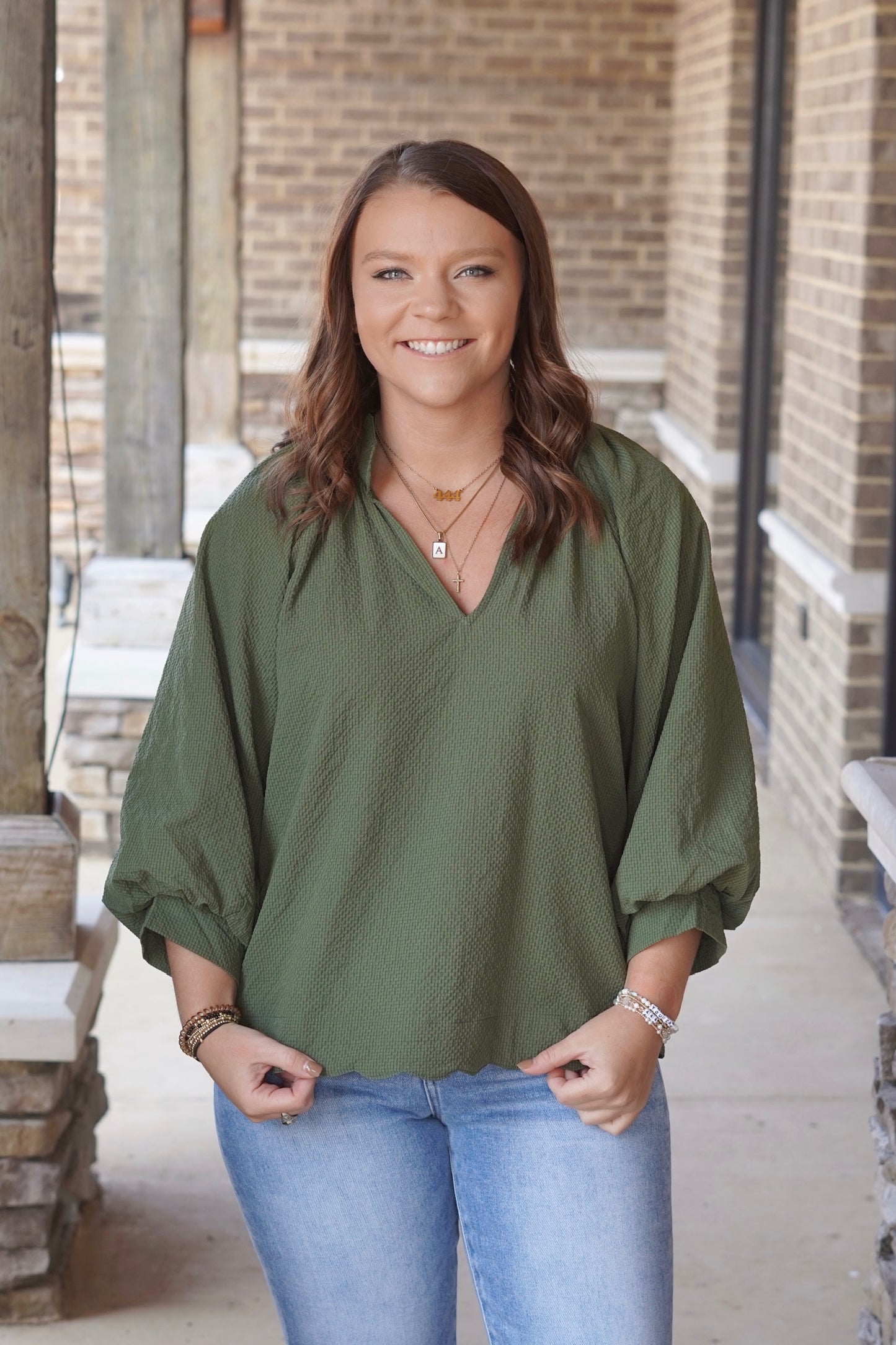 Tilly Textured V-Neck Blouse, V-Neckline, Quarter Length Sleeves, Textured Material, Scalloped Hemline, Relaxed Fit, Full Length, Color: Olive.