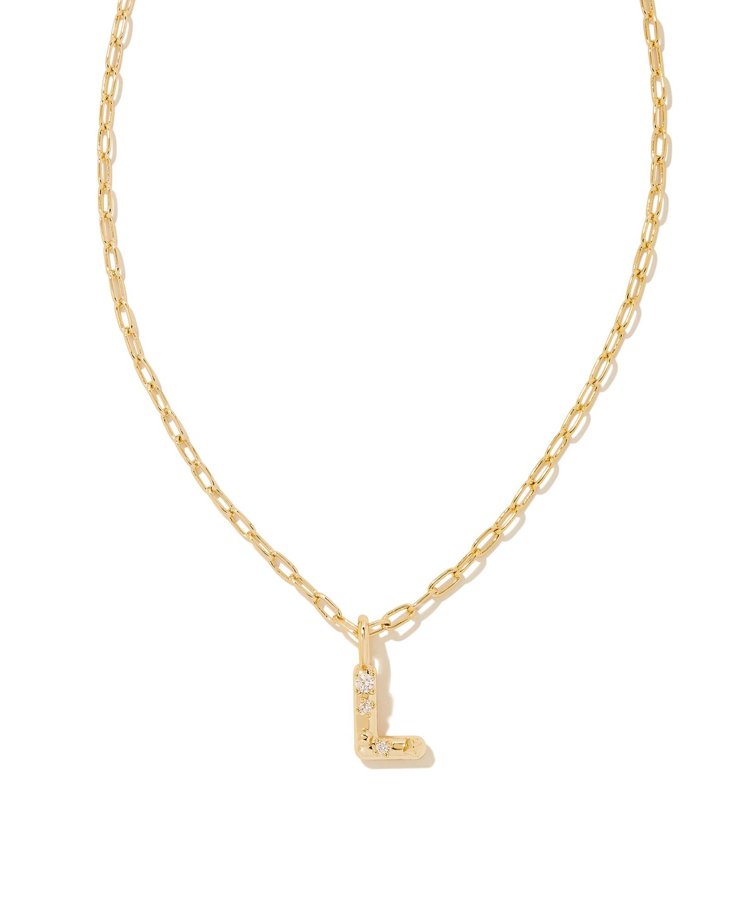 Personalize your everyday look with the Crystal Letter Short Pendant Necklace in White Crystal. Whether you’re rocking your initial or a loved one’s, this sentimental layer is one you’ll keep coming back to again and again.  Dimensions- 16' CHAIN WITH 3' EXTENDER, 0.62'L X 0.35"W PENDANT Metal- 14K Gold plated over brass Closure- Lobster Clasp Material-   White CZ Letter L