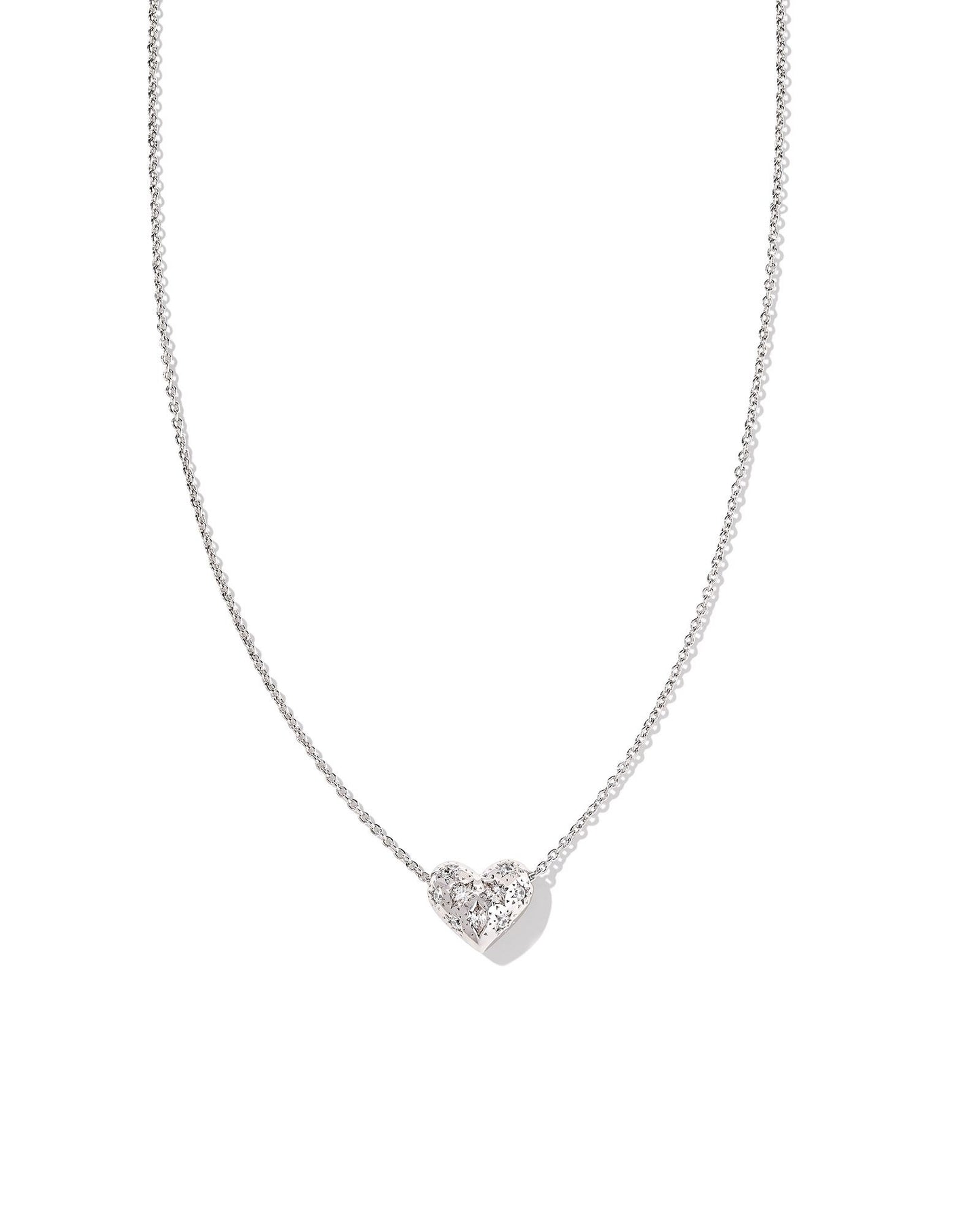 Silver chain with heart pendant with clear crystals on the pendant.
Metal-Rhodium
Closure-Lobster Clasp with Single Adjustable Slider Bead
Size- 19' CHAIN, 0.53"L X 0.46"W PENDANT