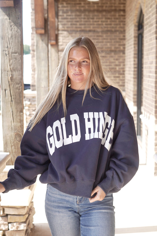 Navy crew neck sweatshirt with white lettering. GOLD HINGE in all caps screenprinted in white. Full length, oversized fit.
Gold Hinge Wide Arm Sweatshirt
Crew Neckline
Long Cuffed Sleeves
Wide Arm Style
"GOLD HINGE" Large Label
Colors: Navy with white lettering
Relaxed Fit
Full Length