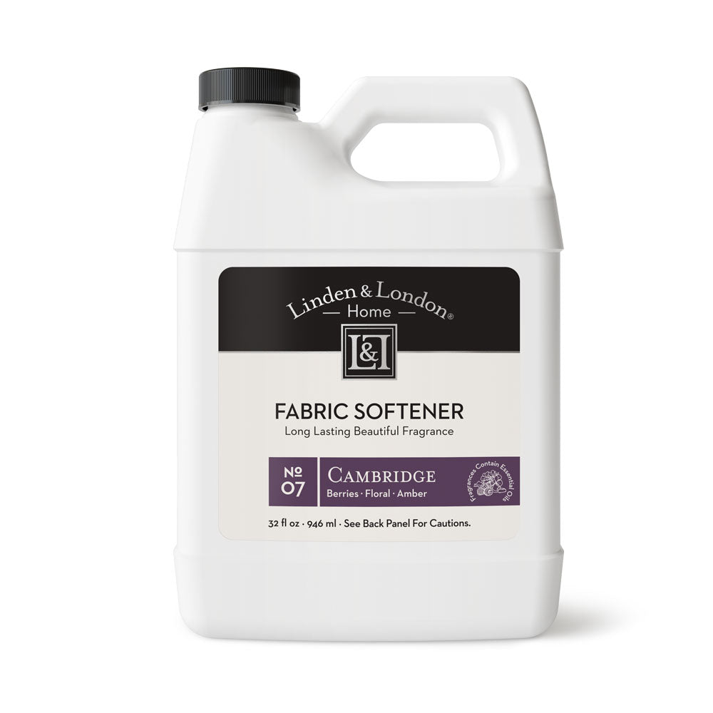 Berries, floral, and amber fabric softener a white bottle with a handle 