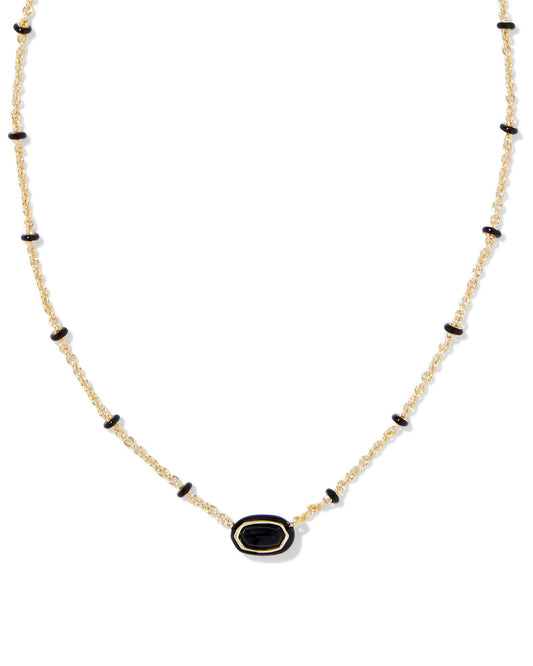 gold necklace with black enamel detailing and a small black stoned pendant