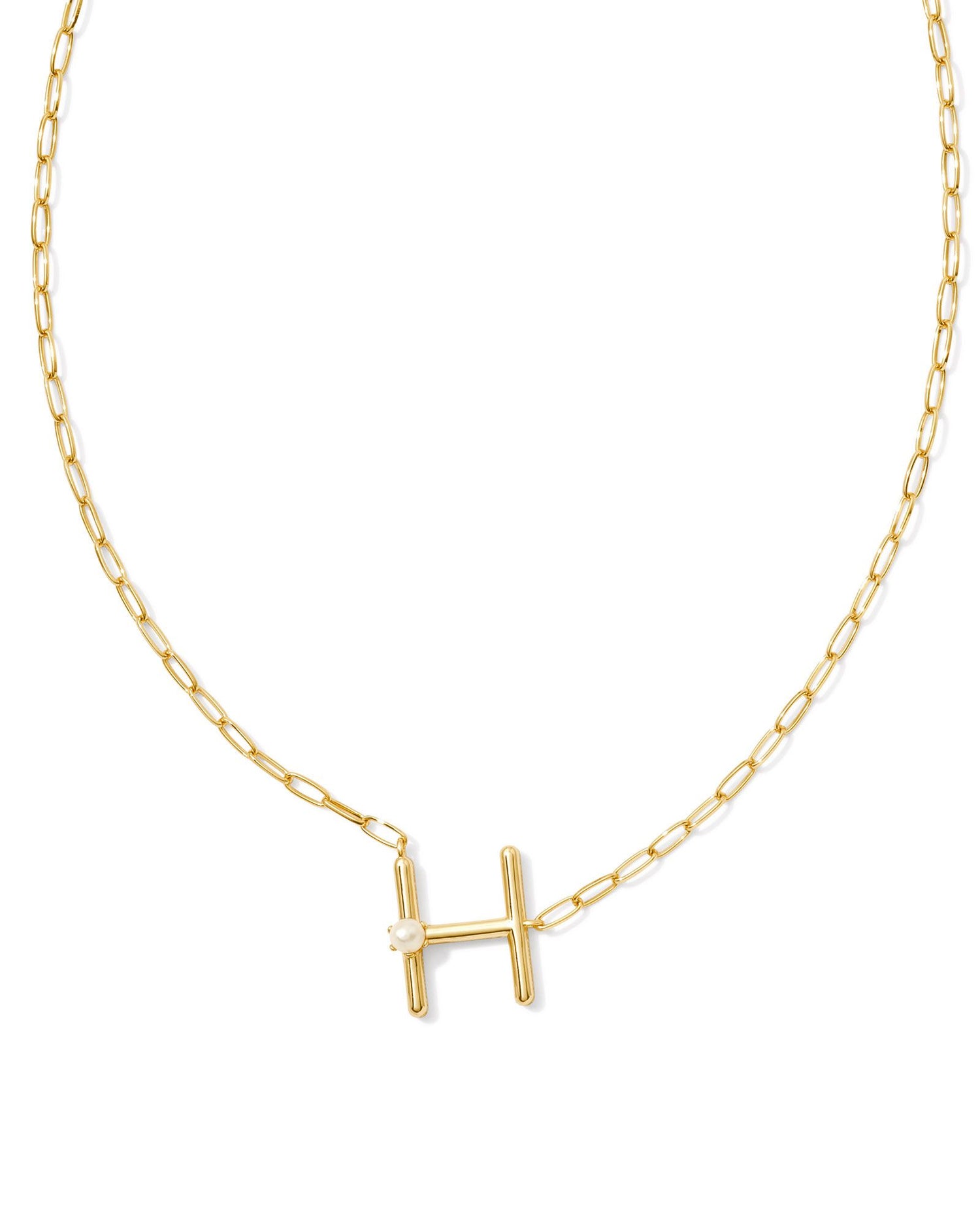 gold necklace with an initial pendant that has a singular pearl stud on it. Initial H