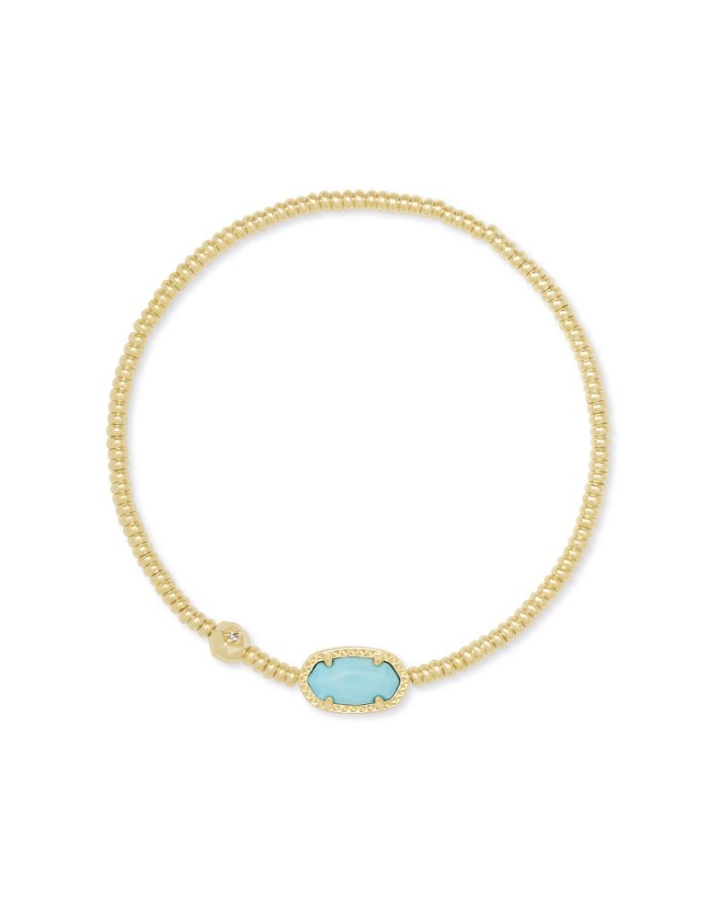 gold beaded stretch bracelet with an oval charm with a blue magnesite center
