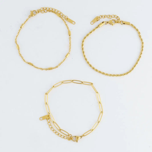 3 bracelet set, one chain, one chain link, one rope, all adjustable, all gold with small dainty details