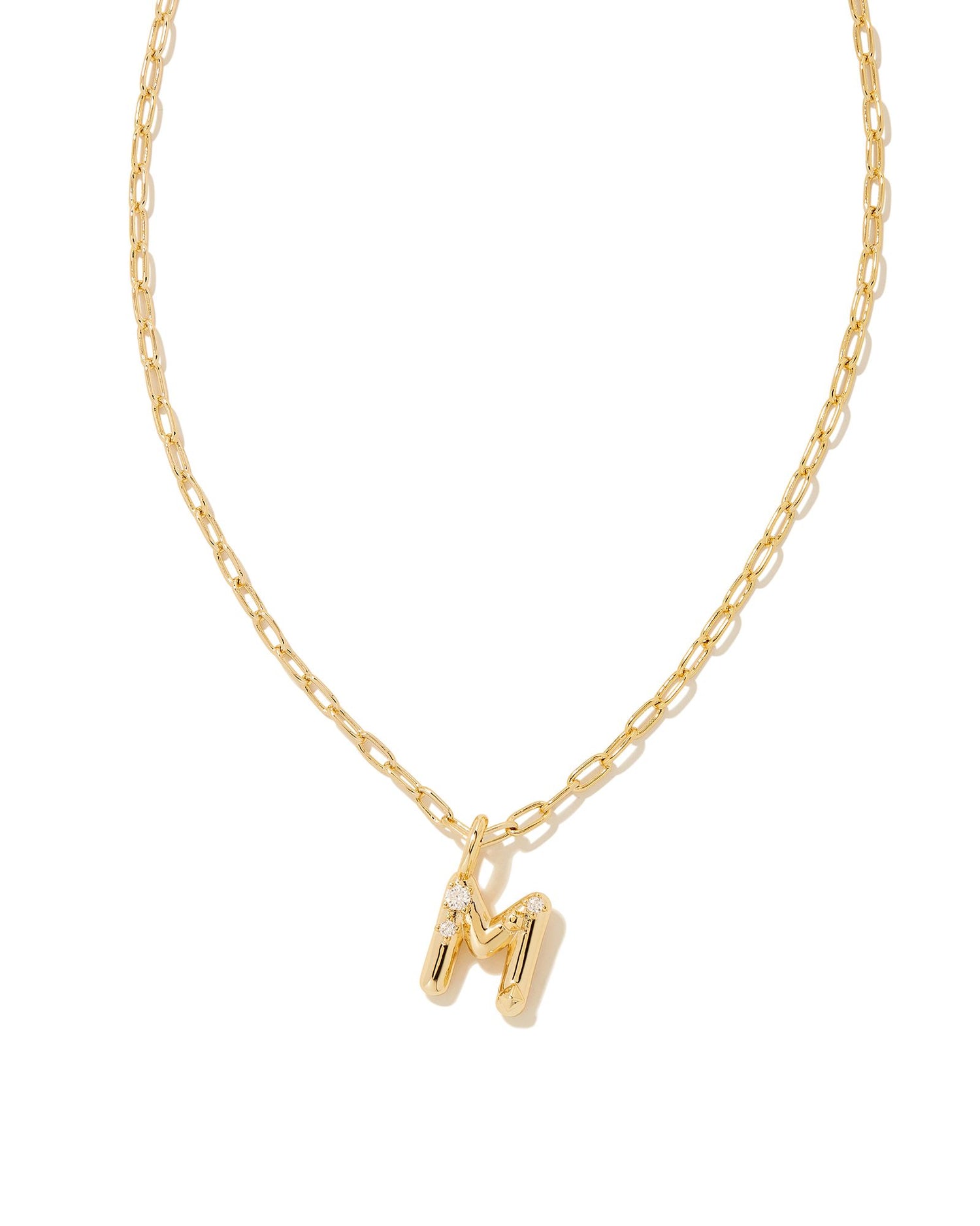 Personalize your everyday look with the Crystal Letter Short Pendant Necklace in White Crystal. Whether you’re rocking your initial or a loved one’s, this sentimental layer is one you’ll keep coming back to again and again.  Dimensions- 16' CHAIN WITH 3' EXTENDER, 0.62'L X 0.35"W PENDANT Metal- 14K Gold plated over brass Closure- Lobster Clasp Material-   White CZ Letter M
