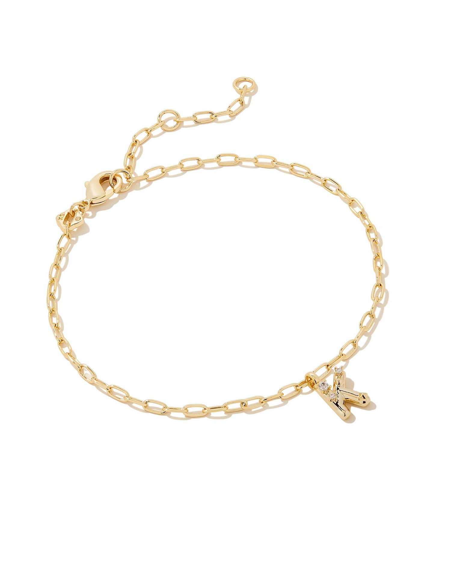 Add a personal touch to your wrist stack with the Crystal Delicate Chain Bracelet in White Crystal, our first Fashion Jewelry initial bracelet. Featuring a dainty chain and letter charm with a hint of sparkle, this bracelet is the perfect way to celebrate the ones you love—including yourself!  Dimensions- 6.5' CHAIN WITH 1.5' EXTENDER, 0.45'L X 0.26"W PENDANT Metal- 14K Gold plated over brass Closure- Lobster Clasp Material-  White CZ Letter K