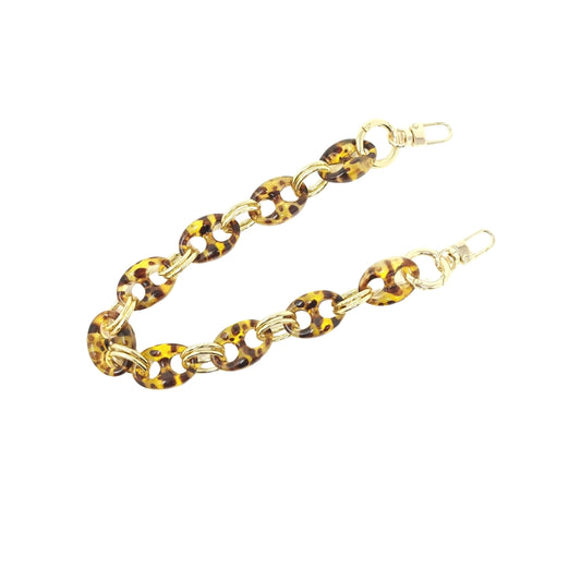 Brown Tortoise and gold hoop chain link purse strap displayed.