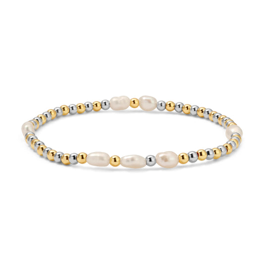 Bracelet with gold, silver, and pearl beads on a white background