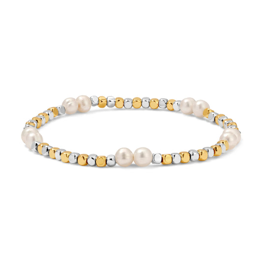 Bracelet with pearls and gold/silver beads on a white background