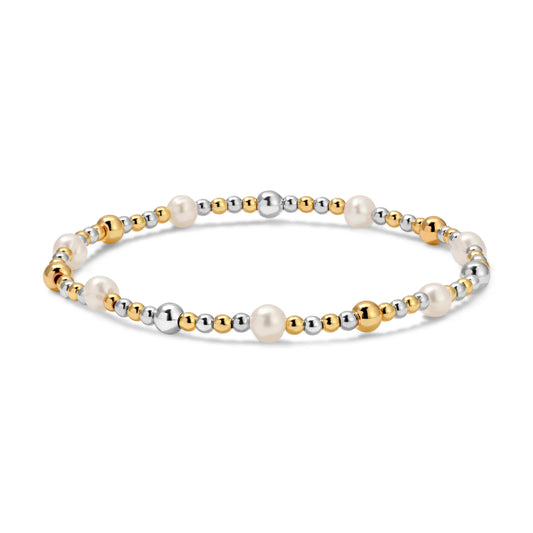 Bracelet with gold, silver, and pearl beads on a white background